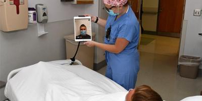 More than 200 iPads installed around campus make virtual visitations possible
