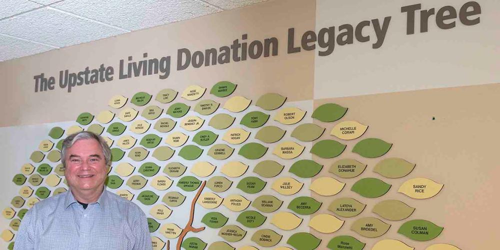 Dr. Oleh Pankewycz in front of the Upstate Living Donation Legacy Tree.
