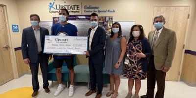Buffalo Sabres star Alex Tuch visits Upstate Golisano Center for Special Needs with $120,000 gift to support multisensory room