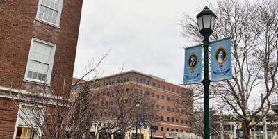 Banners highlighting pioneering women physicians decorate Weiskotten Hall courtyard