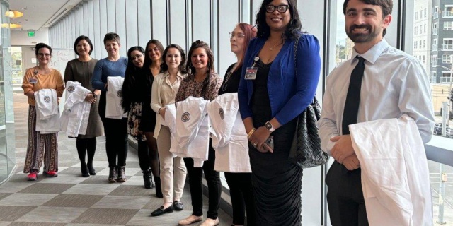 WHITE COATS FOR NURSES: A group of students from the Upstate College of Nursing line up before processing for the college’s White Coat ceremony, which was held Oct. 16 in the CNY Biotech Accelerator.