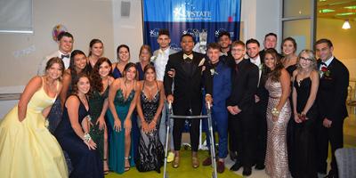 Ilijah Barron, a patient at Upstate Golisano Children's Hospital, stands with his classmates at a senior ball they created for him Saturday, June 19 with the help of his mother, Nelisha.