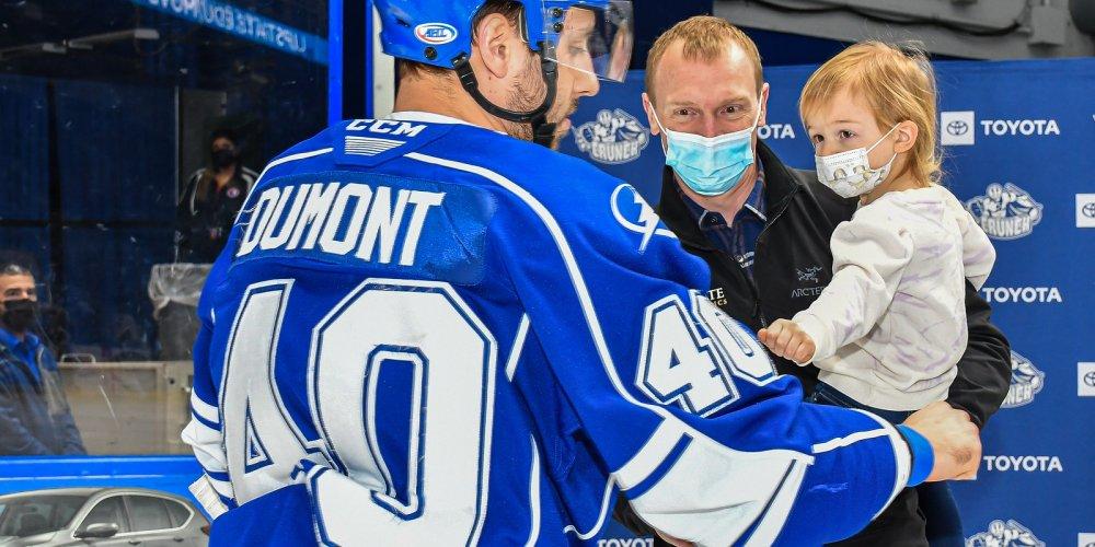 HELLO CAPTAIN: Upstate orthopedist Dr Zachary Vredenburgh, who specializes in sports medicine, introduces his daughter to Syracuse Crunch Captain Gabriel Dumont during recent Upstate Orthopedics Night with the Syracuse Crunch.