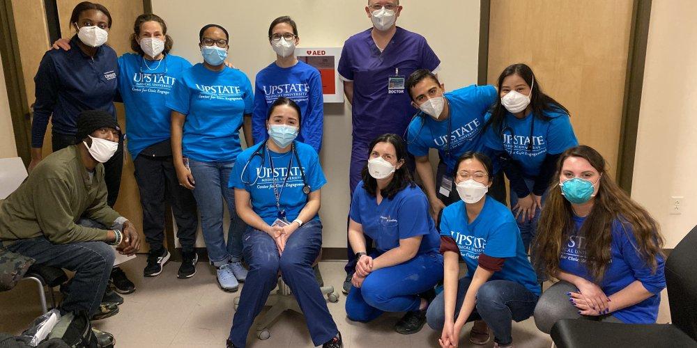 COMMUNITY SERVICE: Dr Barbara Feuerstein enlisted the help of Upstate medical students to take part in Helping Hands for Forgotten Feet clinic at the Rescue Mission. Four community podiatrists also participated.