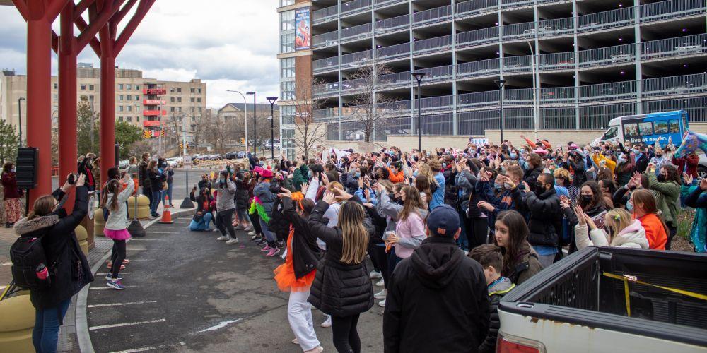 DANCING FOR THE KIDS: Syracuse University students participating in Ottothon, a dance marathon to support Children’s Miracle Network hospitals, perform outside Upstate Golisano Children’s Hospital March 26. Ottothon raised more than $100,000 for the children’s hospital.