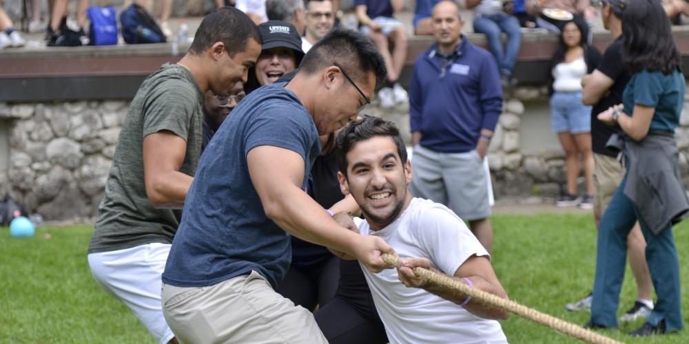 TUG OF WAR: Students in the Norton College of Medicine Learning Communities take part in athletic competitions, like tug of war, this week in Thornden Park.