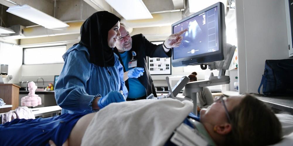HANDS-ON EDUCATION: Onondaga Community College students take part in a mock emergency room case as part of the College of Health Professions program to introduce local youth to heath care jobs. The college offers a dozen degree programs in some of the most sought-after health care career fields.