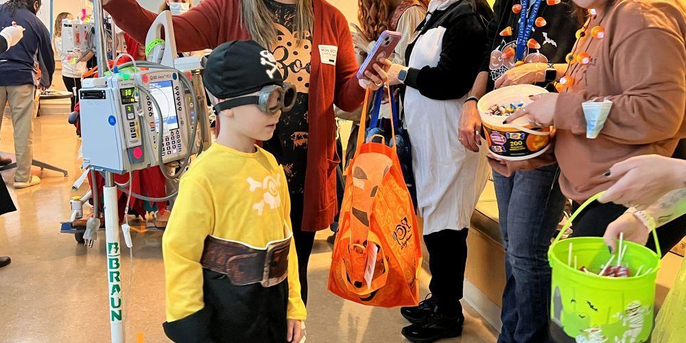 TRICK-O-TREAT: Minions, princesses, and wizards made their way around Upstate Golisano Children’s Hospital collecting treats from costumed Upstate employees, who filled more than 60 treat stops for the annual Halloween Day parade. For patients unable to participate, medical students donned masks and gathered the goodies on their behalf.