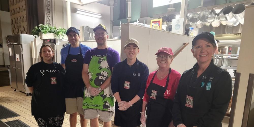 GOOD SAMARITANS: Upstate Emerging Leaders United members took part in serving breakfast at Syracuse’s  Samaritan Center during a recent outreach event. Serving up the hot breakfasts are, from left, Renae Rokicki, Matthew Capogreco, Scott Neal, Bill Tan, Elizabeth Drescher and Bobbie Jo Massena. The Samaritan Center provides hot meals daily to anyone who is hungry.