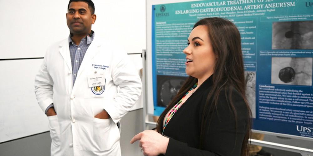 POSTER PRESENTERS: Surgery residents Naveed Rahman, MD, and Sydney Read, MD, were among those offering poster presentations at Beyond the Doctorate Research Day March 6. More than 30 posters highlighting research by Upstate students and faculty were on display, highlighting a range of research subjects, including blood loss during Cesarean delivery, medication adherence and ischemic stroke.