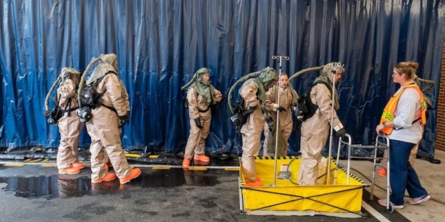 DECON DRILL: Upstate University Hospital employees participate in a decontamination drill. The aim of the exercise was to test the capability of Upstate staff to recognize and react to a certain number of patients arriving to the Emergency Department who are contaminated with a chemical substance.