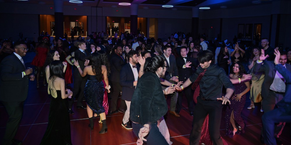 COME IN FROM THE COLD: Students turn up the heat on the dance floor at the Arctic Blast, a key date on the Upstate student social calendar. More than 300 students attend the event, held at the Oncenter. 