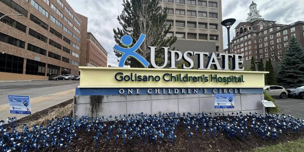GO BLUE:  Pinwheels are ‘planted’ outside of Upstate Golisano Children’s Hospital in support of McMahon Ryan Child Advocacy Center’s “Go Blue 4 Kids” campaign. Each pinwheel represents hope, resilience, and a brighter future for every child. Upstate recognizes National Child Abuse Prevention Month, standing together to protect and uplift the most vulnerable.