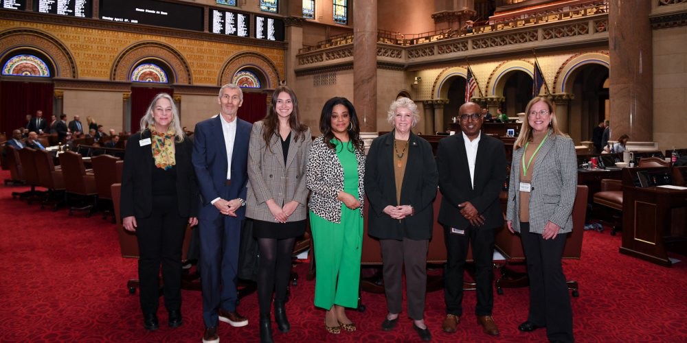 TICK AWARENESS: Saravanan Thangamani, PhD, director of Upstate’s Vector Biocontainment Laboratory, second from right, is joined on the Assembly floor April7 by other state leaders fighting Lyme and tick-borne diseases, including, from left, Maribeth Rubenstein, Cary Institute for Ecosystem Studies; Steve and Olivia Abrams, Project Lyme; Assembly members Pam Hunter and Didi Barret; and Elizabeth Balfore, CNY Lyme and Tick-borne Disease Alliance. The Assembly passed a resolution proclaiming April as Lyme Disease Awareness Month in New York.