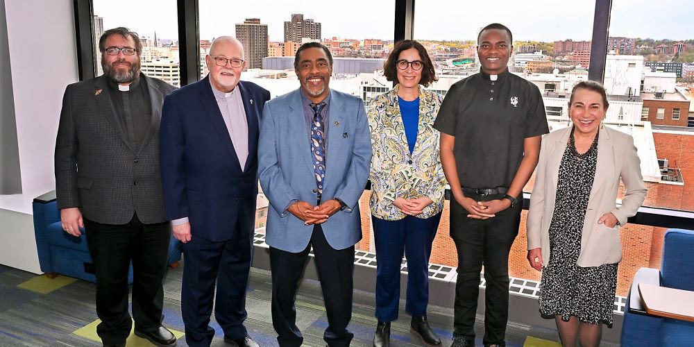 CELEBRATING UPSTATE’S CHAPLAIN INTERNS: Four chaplain interns graduated this week from Upstate Clinical Pastoral Education program. Flanked by Father Eric Malcom, left, and Rev. Terry Culbertson, right, are, from left, Deacon Tom Cushy, Pastor Ralph Featherstone, Tina Dillman and Father Vincent Oguejiofor. Clinical Pastoral Education (CPE) is experiential theological education designed to improve the quality of spiritual care offered by spiritual caregivers of all faiths and levels of experience.
