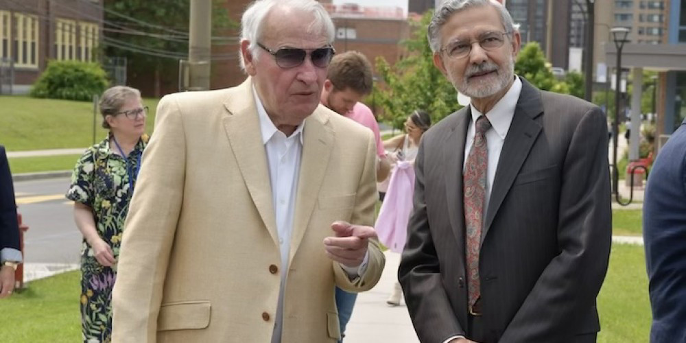 GOLISANO GREETING: Upstate President Mantosh Dewan, MD, right, with Tom Golisano shortly after Golisano’s arrival at a celebration in his honor Wednesday. Golisano has been a champion for children in CNY. In recognition of his beneficence, various buildings and services dedicated to pediatric care on the Upstate campus bear his name, most notably Upstate Golisano Children’s Hospital.