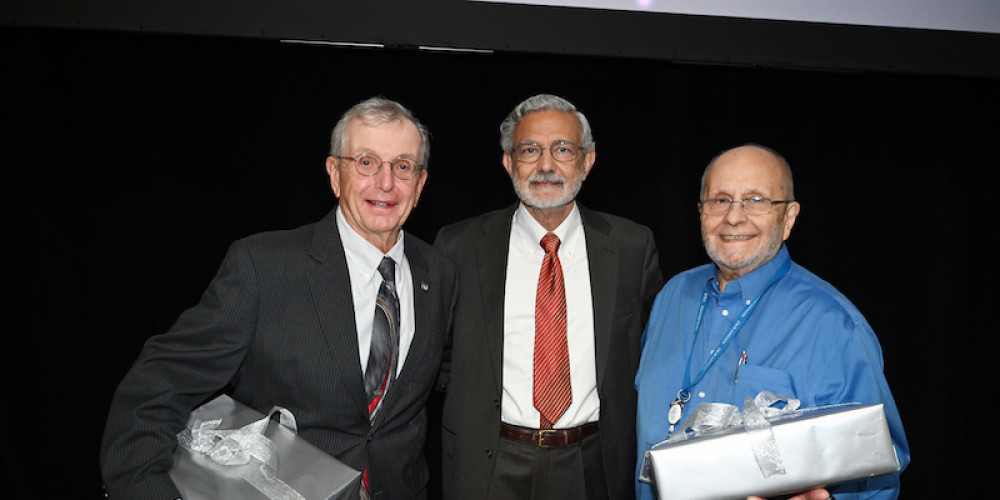 FIFTY TIMES THREE:  Being recognized for half a century of service to Upstate, are, from left, Professor Gary Niemann, President Mantosh Dewan, MD, and Professor Daniel Bassano, PhD. Hundreds of employees at Upstate were recognized for various milestones of service during the university’s Employee Recognition Day event.