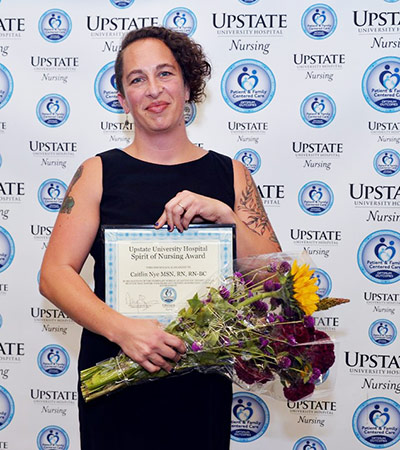 Caitlin Nye  with her award.