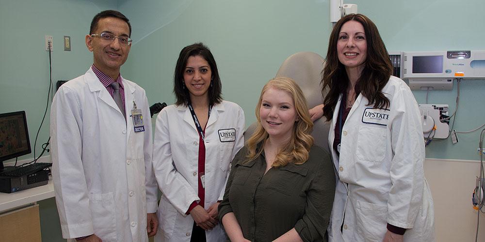Pathology Lab Team Members with Patient