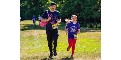 Addy and Justin trudging toward the finish line of Amer's epilepsy trail run