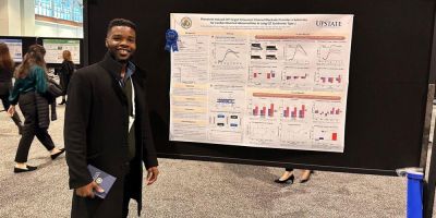 Lou presents a poster at AES 2022