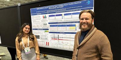 Veronica and Kyle present a poster at AES 2022