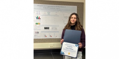 Laura with her poster and award.
