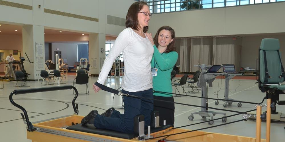 Physical therapist helping a patient