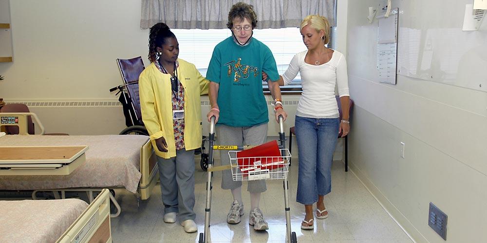 woman assisted in walker