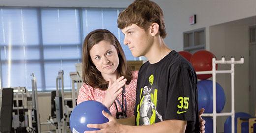 young patient working with physical therapist Maureen Mancuso
