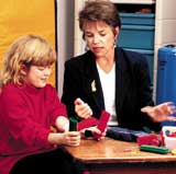 University Hospital PT, Lynne Logan with young patient.