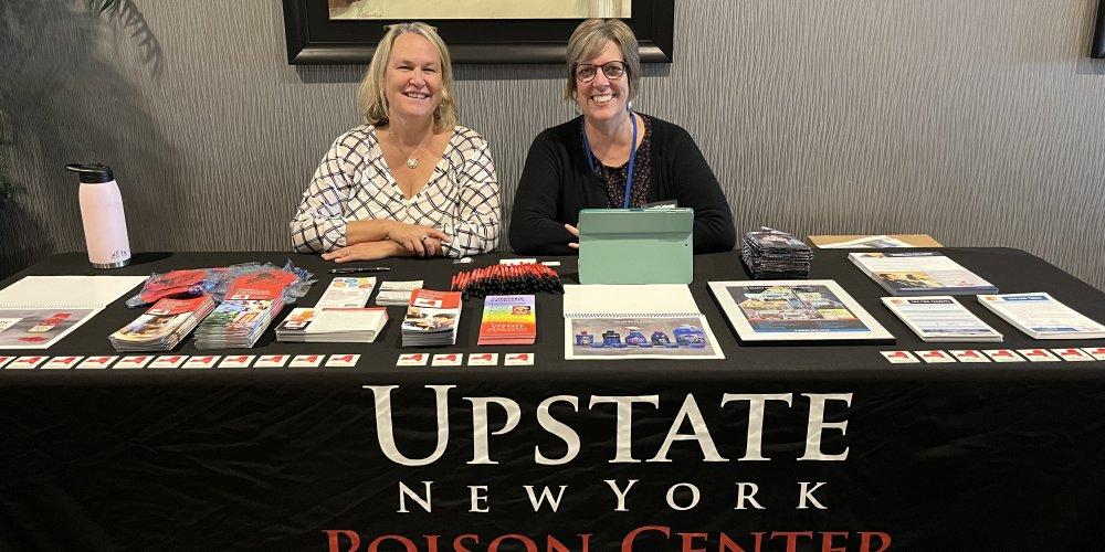 Two Health Educators sitting at a table.