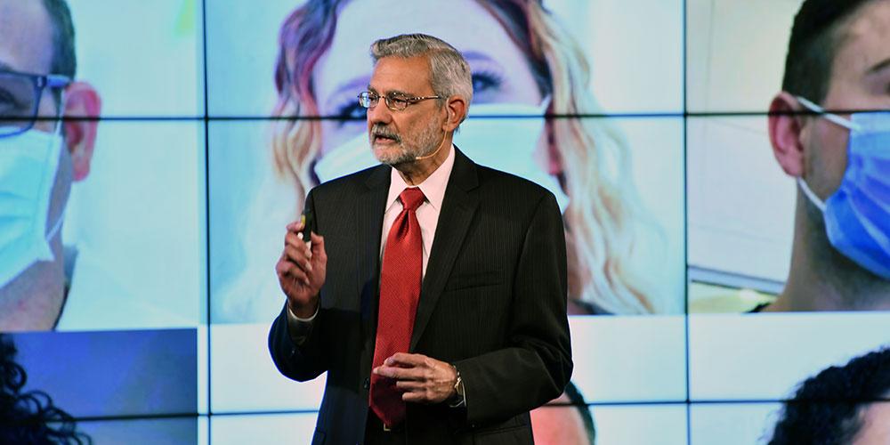 Dr. Dewan giving the State of the University speech