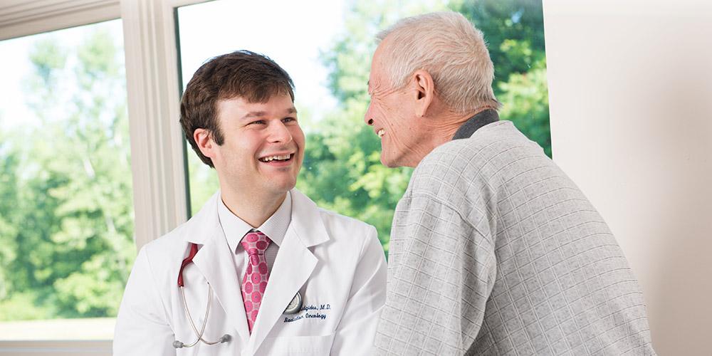 Doctor with patient - smiling