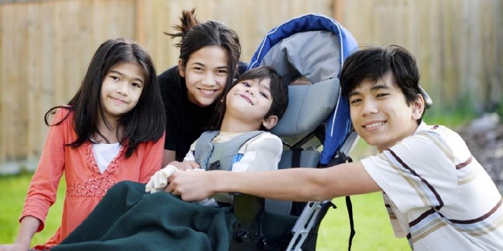 A family smiling with child in stroller
