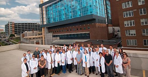 Doctors and staff pose outside Upstate
