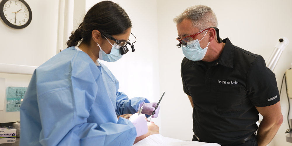 Dr. Singh and Dr. Smith performing dental work