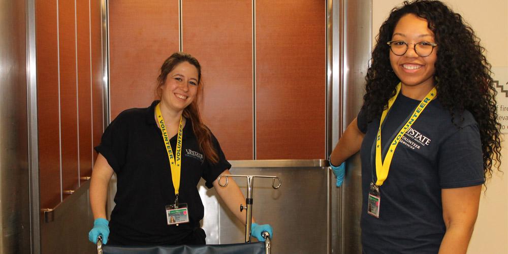 2 volunteers in the elevator