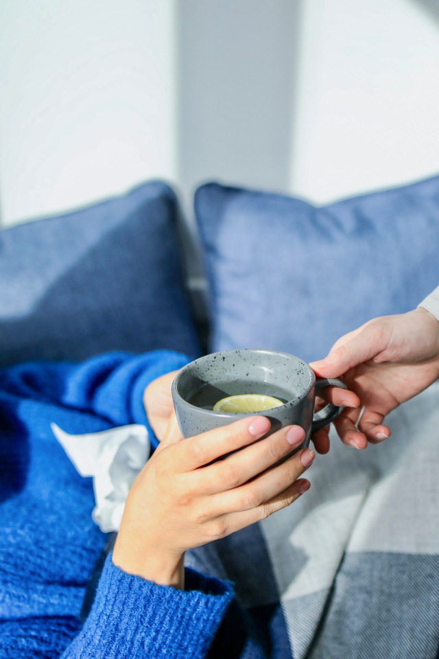 person holding a mug