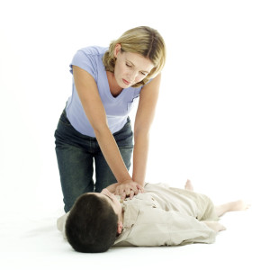 Woman Resuscitating a Young Boy Woman Resuscitating a Young Boy