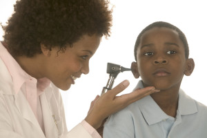 C Healthcare worker looking in child's ear