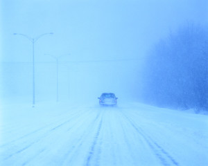 Car on Snow-Covered Road Car on Snow-Covered Road