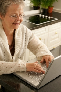 MP900442545 Woman typing on computer
