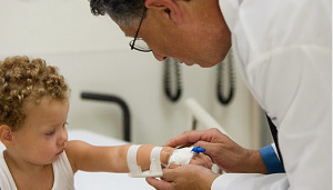 Healthcare worker checkin on child's IV
