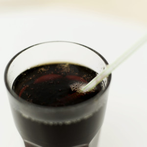 Glass of Cola with a Straw in It