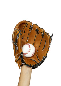 Hand in Baseball Glove Catching Ball