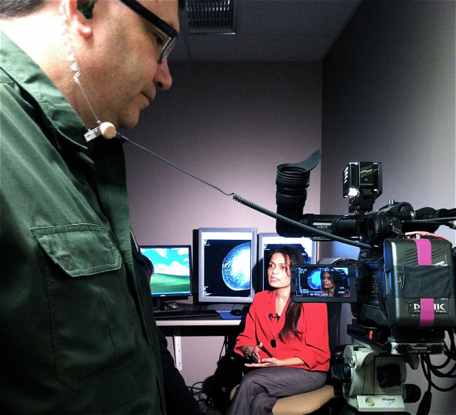 Photographer Jim Kearns and reporter Leigh Isaacson from NewsChannel 9 interview Dr. Deepa Masrani, director of women's imaging at Upstate. Photo by Kathleen Paice Froio.