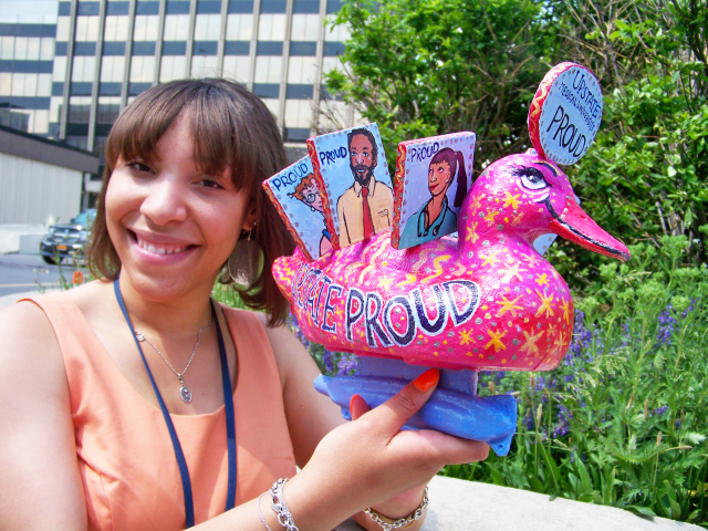 Kristin Thompson holds the Proud To Know Upstate duck, which will be part of the Duck Race To End Racism Saturday, June 8 at Syracuse‘s Inner Harbor.