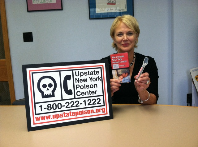 Gail Banach of the Upstate New York Poison Center displays the calibrated medicine spoon, the preferred way to dispense liquid medicine to children when the medicine is not packaged with its own dosing device.