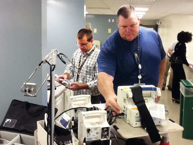 Chuck Adams and Chuck Rogers test physiological monitoring equipment
